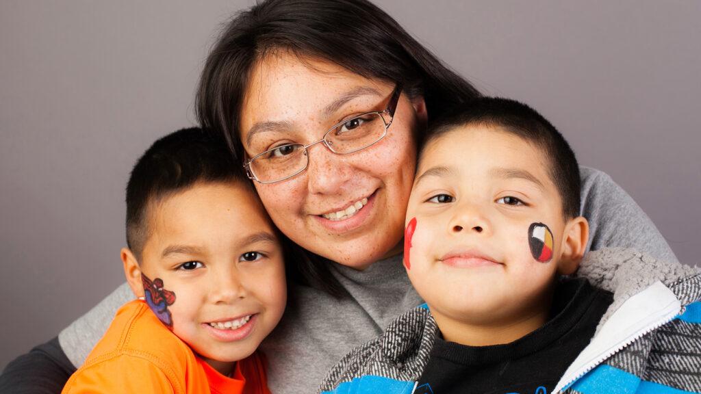 Native mother with two young sons.