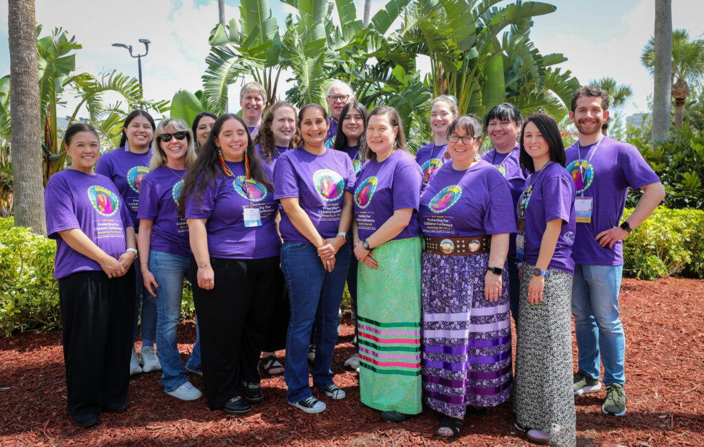 Photo of NICWA staff standing in Purple shirts
