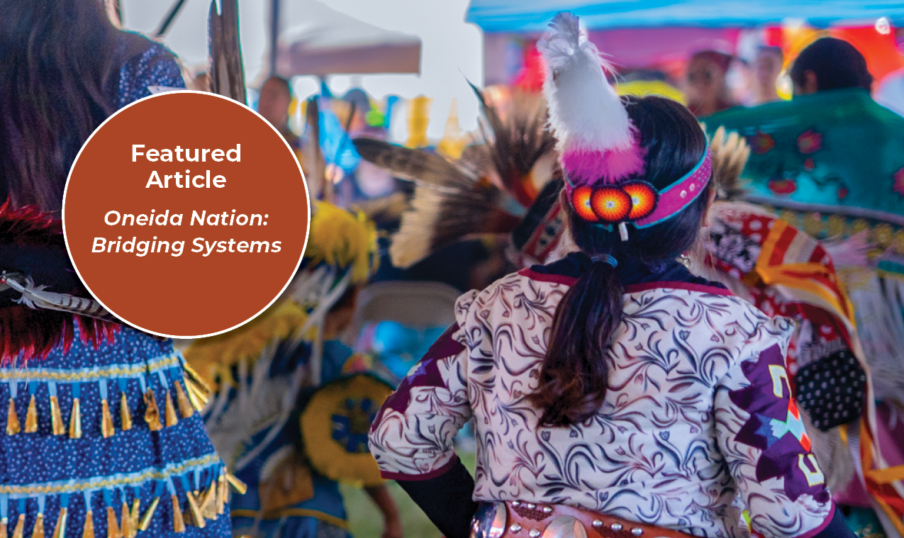 A young jingle dress dancer in purple and white regalia dances at a powwow. A circle graphic with text reads "Featured Article. Oneida Nations: Bridging Systems".